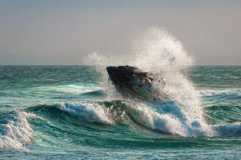 Riding a jet ski in the ocean waves