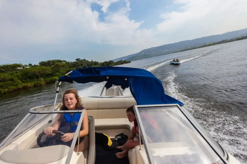 Open Bow boat towing a tube outboard