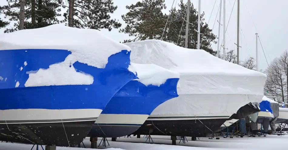 Boats shrink wrapped in the snow